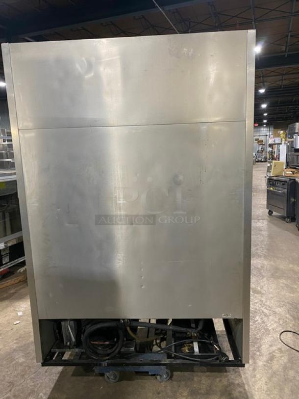 True T49F commercial stainless steel 2-door reach-in freezer, rear view. Features poly-coated wire rack, 115V, 1 phase.