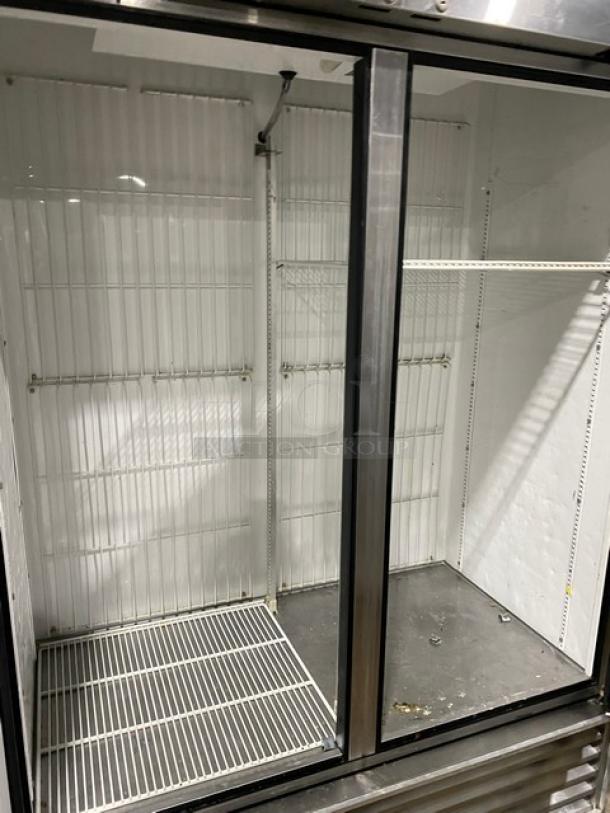 True T-49F 2 Door Stainless Steel Reach-In Freezer, poly-coated wire racks, commercial use, 115V 1 Phase, visible wear.