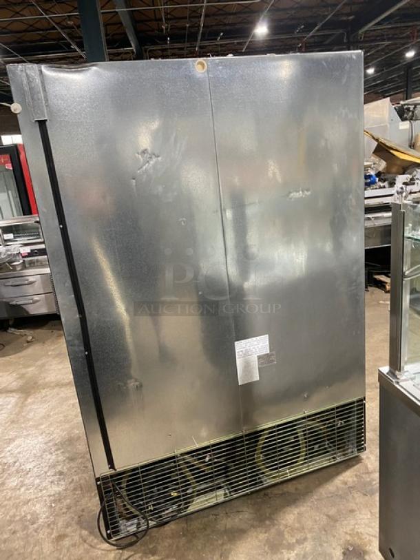 Kool-It commercial freezer, Model 163LX46FB, double glass doors, poly-coated racks, on casters, slight exterior dents visible.