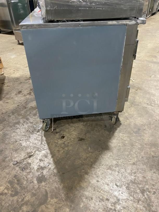 CoolTech CMPH-48LBB stainless steel 2-door lowboy worktop refrigerator, on casters, in used condition. Model CMPH48LBB, 120V.