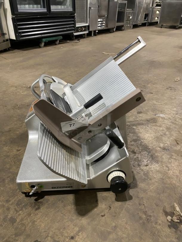 Bizerba commercial electric countertop meat slicer, 120V, on legs, used condition, model and branding visible.
