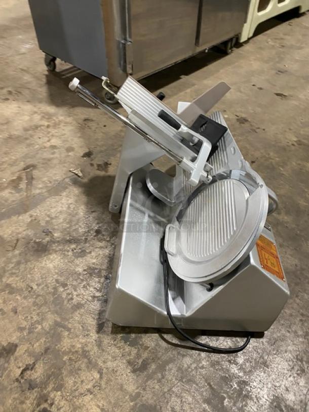 Bizerba commercial electric countertop meat slicer, 120V, on legs, silver finish, visible control dial, used condition.