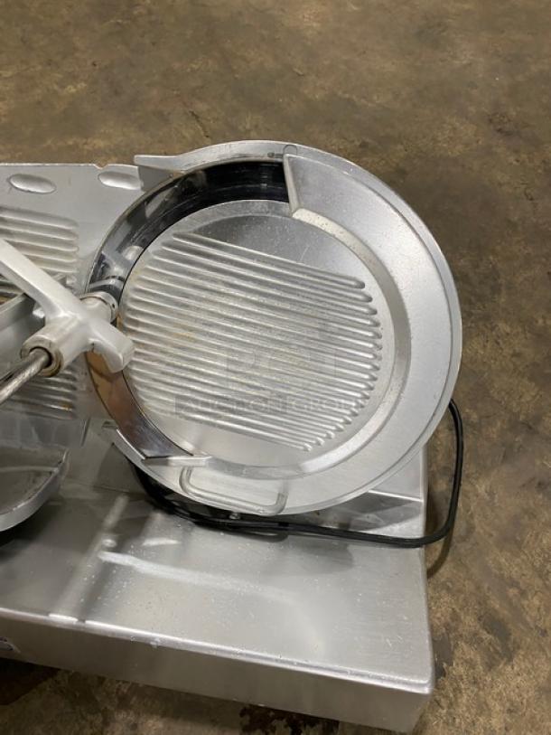 Bizerba commercial electric countertop meat slicer, 120V, on legs, silver finish, shown in used condition with electrical cord.