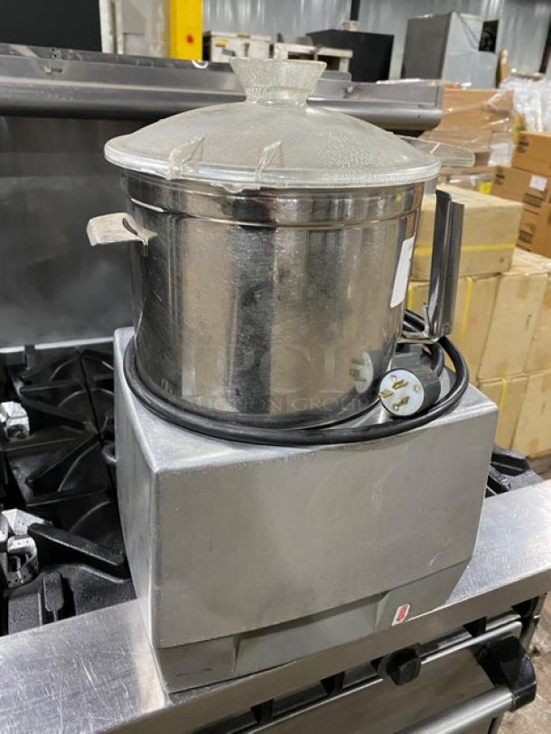 Robot Coupe R602VV food processor with stainless steel 7 qt. mixing bowl, electric-powered, countertop model, on legs.