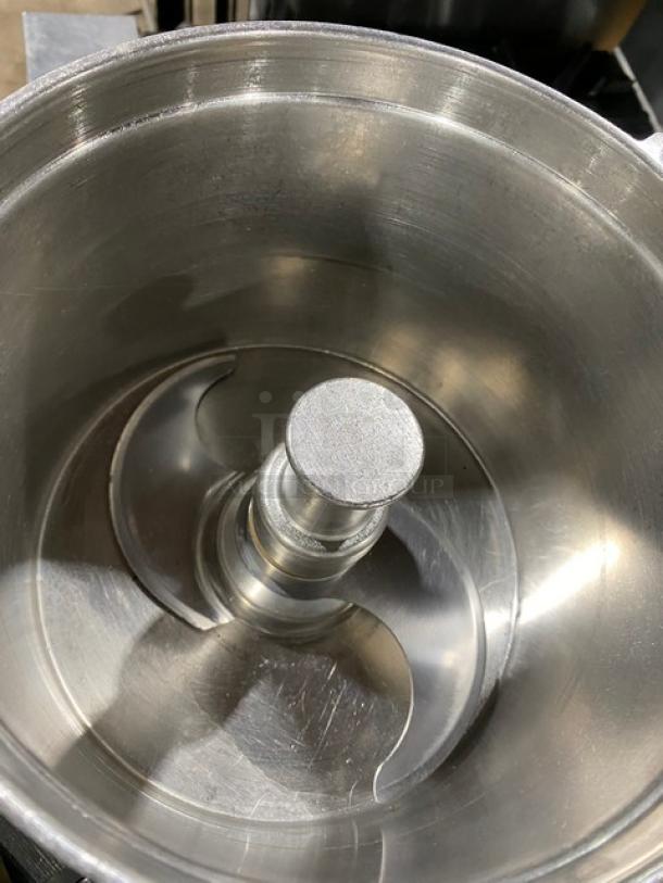 Robot Coupe R602VV food processor with a 7 qt stainless steel mixing bowl, visible blades, and durable construction.