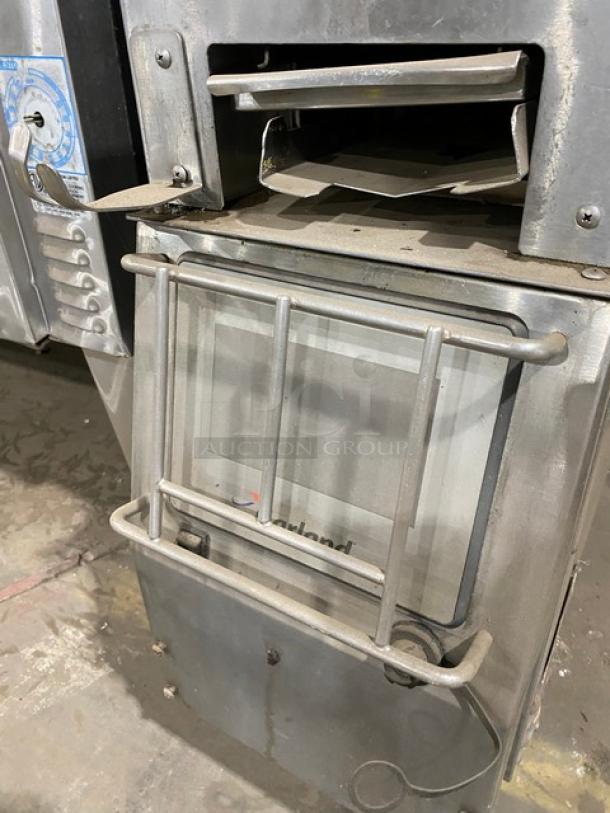 Garland CXBE12 stainless steel dual-side clamshell broiler on casters, electric-powered, visible controls and grill surface.
