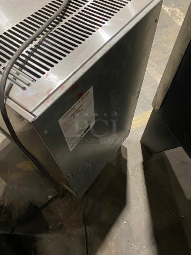 Hoshizaki DCM-270BAH stainless steel ice/water dispenser, countertop model, with drip tray, air-cooled, electric, 115-120V, on legs.