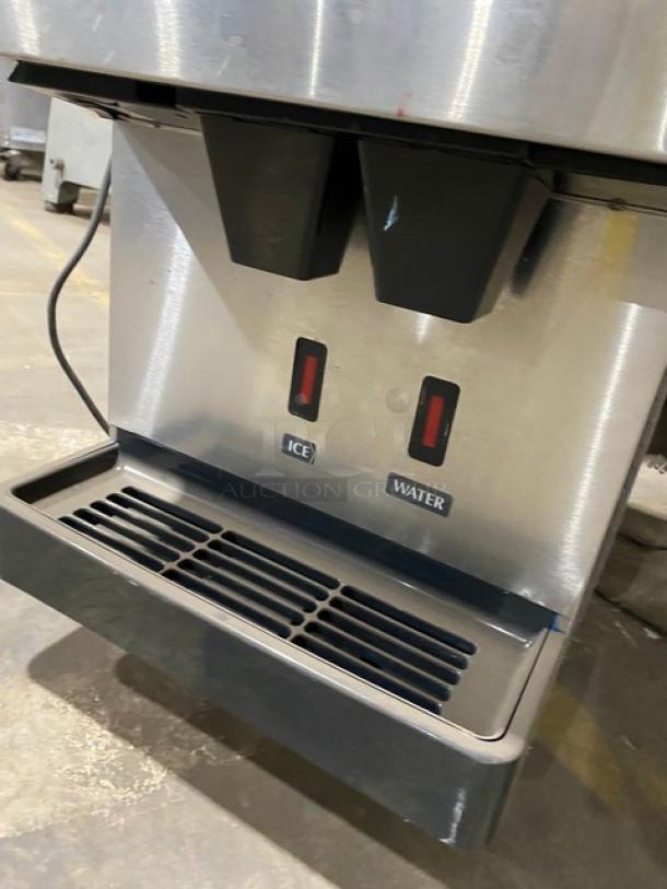 Hoshizaki DCM-270BAH countertop ice/water dispenser, stainless steel, electric, air-cooled, with drip tray, leg-mounted.