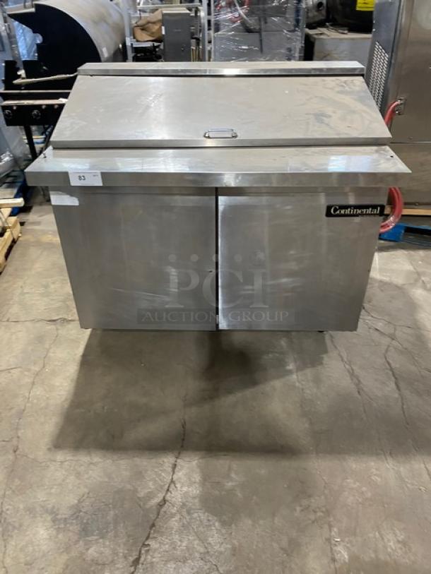 Continental commercial stainless steel 2-door refrigerated Bain Marie style prep table with poly coated wire racks on casters.