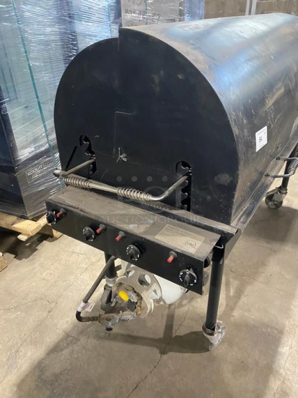 Porta-Grill PG-2460-II black propane BBQ grill on casters; commercial-grade with control knobs, visible labels, used condition.