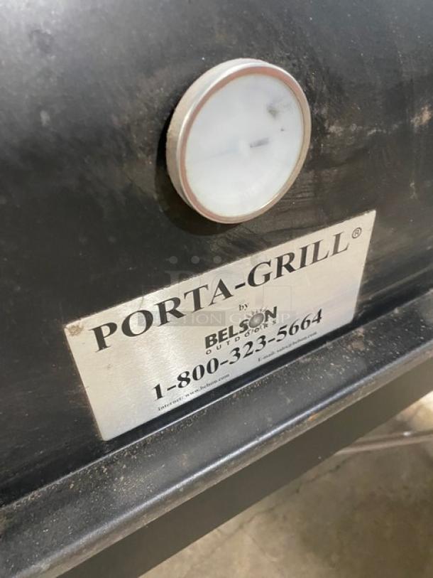 Porta-Grill PG-2460-II black propane BBQ grill, Belson label with contact info, thermometer gauge visible. In used condition.