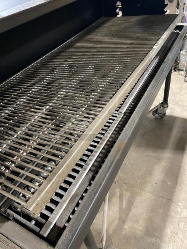 Porta-Grill PG2460II black propane BBQ grill on casters; features stainless steel grates, sturdy build, and branding label.