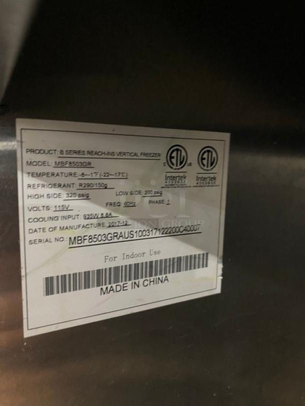 Atosa B-Series commercial stainless steel 2-door vertical reach-in freezer, Model MBF8503GR, energy-efficient, poly-coated racks, on casters, good condition.