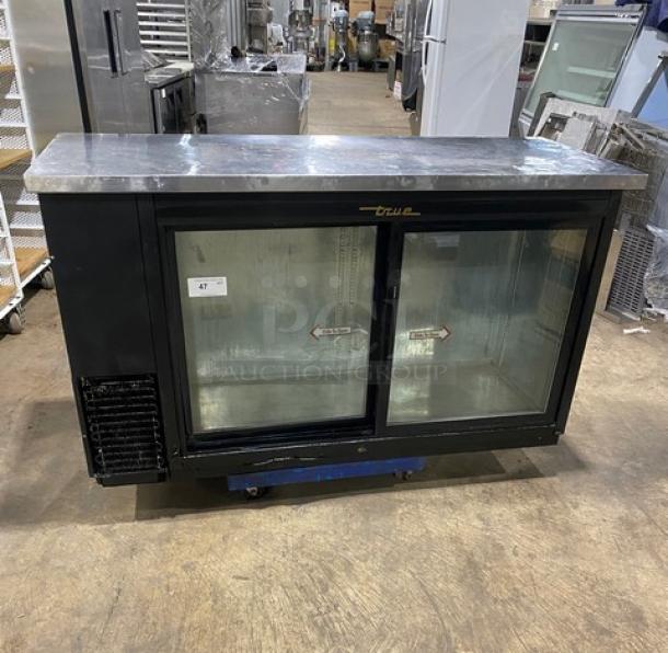 True Commercial Black Double Glass Sliding Door Back Bar Cooler, Model TBB-24-60G-SD, stainless steel worktop.