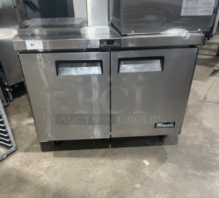 Migali 2016 stainless steel undercounter worktop refrigerator, model CU48R, with poly coated wire racks, on casters.