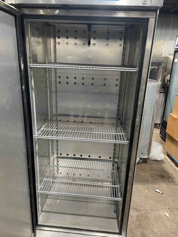 True T19FHC single door stainless steel freezer, Energy Star certified, with poly-coated wire racks, on casters, in good condition.