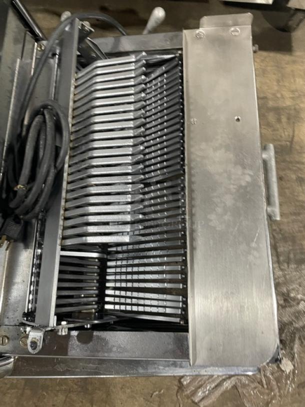 Berkel commercial stainless steel electric bread slicer, countertop model, 115V, 1 phase. Good condition, visible power cords.