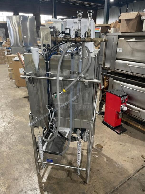 Ecolab Smartpower stainless steel dishwashing machine, model APEXTSC, single rack, electric, 115V, on legs, shown in warehouse.