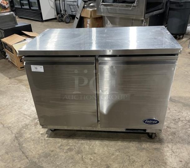 Entree UR48 stainless steel 2-door undercounter worktop refrigerator with poly coated wire racks. On casters, 115V 1 Phase.