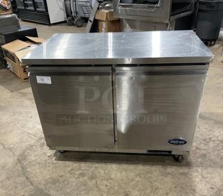 Entree UR48 stainless steel 2-door undercounter worktop refrigerator with poly coated wire racks. On casters, 115V 1 Phase.