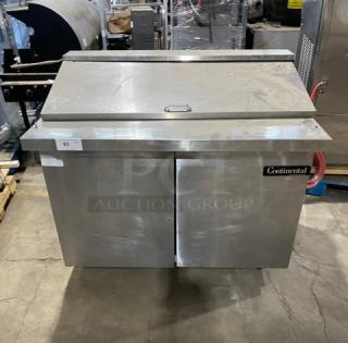 Continental stainless steel 2-door refrigerated prep table with bain marie style top, poly-coated wire racks, and casters.