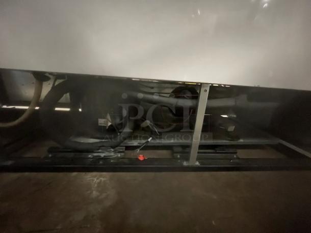 True GDM-72F-LD freezer underside, showing components and wiring. Model and serial numbers visible. Good condition.
