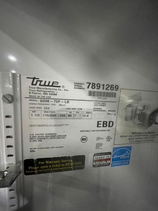 True GDM-72F-LD merchandiser freezer label, showing model, serial number 7891269, voltage specs, and Energy Star certification.