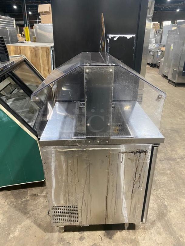 Turbo Air MST-28711S stainless steel refrigerated prep table with sneeze guard and poly-coated wire rack, used condition.
