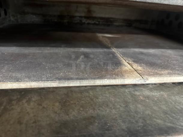 Bakers Pride stainless steel pizza deck oven, natural gas, 4-pie capacity, thermostatic control, used condition.