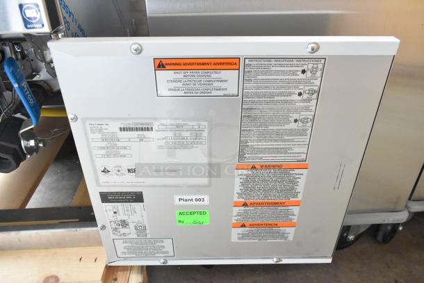 Brand new 2022 Pitco Frialator SG14 stainless steel commercial fryer, 110,000 BTU, with 2 metal baskets; features warning labels.