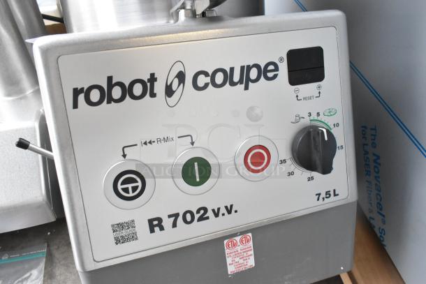 Brand new Robot Coupe R702V.V food processor, metal body, with control panel. Includes bowl, feed head, grater, slicer.