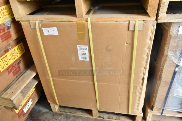 Brand new Master-Bilt UF27 undercounter freezer in box, 115 volts, 1 phase, stainless steel, model UF27 label visible.