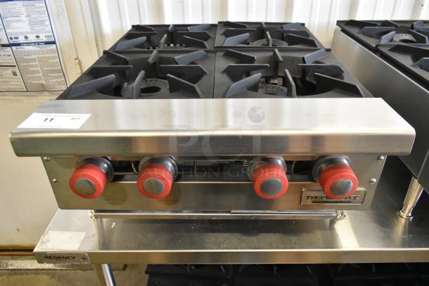 Brand new Therma-Tek TCHP24-4L stainless steel 4-burner propane range, 30,000 BTU, modern, durable construction.