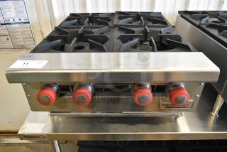 Brand new Therma-Tek TCHP24-4L stainless steel 4-burner propane range, 30,000 BTU, modern, durable construction.