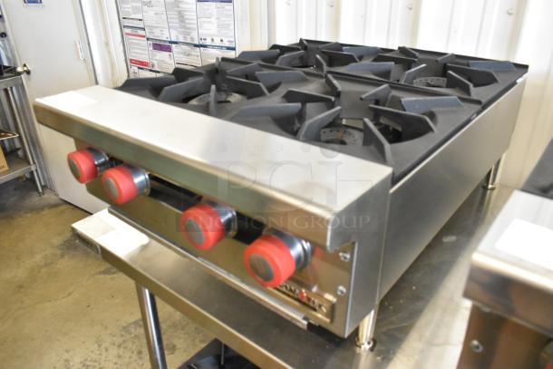 Brand new Therma-Tek TCHP24-4L stainless steel 4-burner propane gas range, 30,000 BTU, red control knobs.