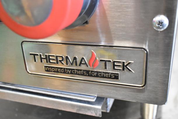 BRAND NEW Therma-Tek TCHP24-4L stainless steel 4-burner propane range, 30,000 BTU, close-up of logo plate.