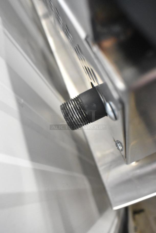 Stainless steel connector detail on a brand new Therma-Tek TCHP24-4L propane gas 4-burner range, 30,000 BTU, commercial use.