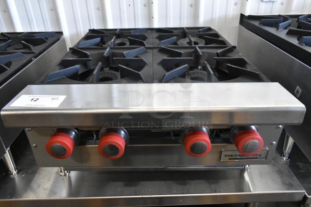 Brand new Therma-Tek TCHP24-4L 4 burner stainless steel propane range, 30,000 BTU, with red knobs and branding.
