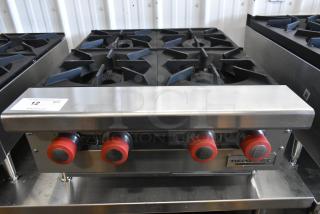 Brand new Therma-Tek TCHP24-4L 4 burner stainless steel propane range, 30,000 BTU, with red knobs and branding.