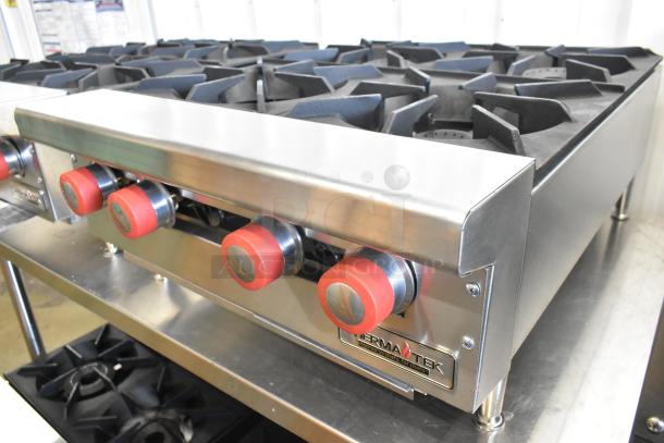 Brand new Therma-Tek TCHP24-4L stainless steel 4 burner propane range, 30,000 BTU, red knobs, with logo.