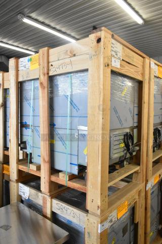 BKI 52473-1 Stainless Steel Commercial Freezer in crate, brand new, on casters, 115V, 1 phase. Model number visible.