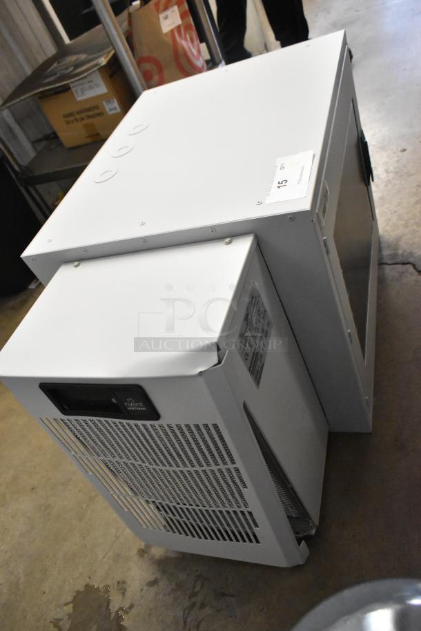 Brand new Hoffmann Spectracool Compact AC, model N170116G010, 115V, 1025 BTU, with visible labels.