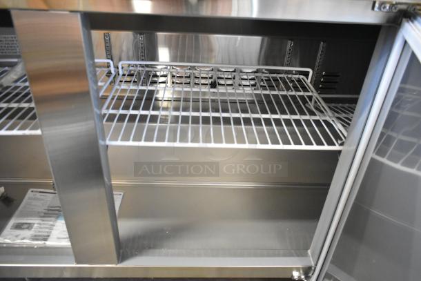 Brand new 2023 KoolMore RWT-3D-16C stainless steel 3-door worktop cooler, missing 1 caster, with wire shelves; 115V, 1 phase.