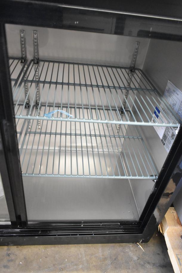 Brand new 2025 Avantco 178UBB72SHC 73" black bar fridge, sliding glass doors, LED lighting, 115V, minor scratches.