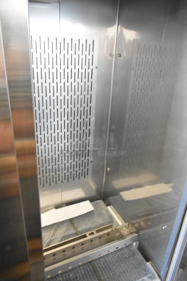 Brand new Avantco 178SS3FHC 3-door stainless steel freezer interior with poly-coated racks, 115V, commercial use.
