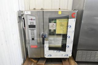 Brand new Cleveland OEB-10.10 stainless steel commercial electric combi convection oven. 440/480V, 3 phase, with visible handling instructions.