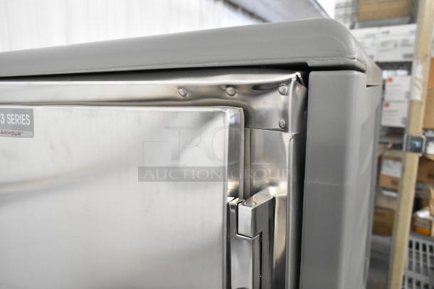 Brand new Metro C537-HFS-U-GY heated holding cabinet with solid door, showing minor dents. Features durable construction.