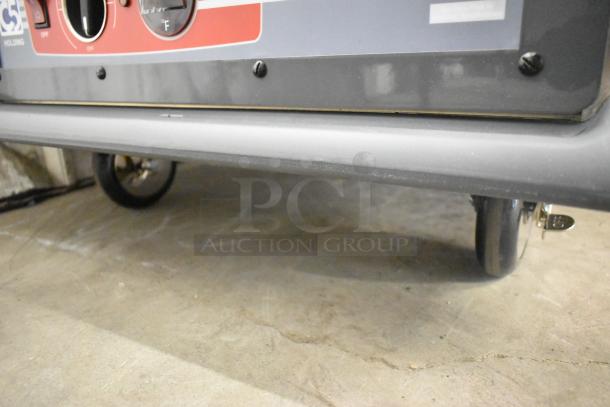 Brand new Metro C537-HFS-U-GY heated holding cabinet, solid door, commercial casters, 120 volts, slight scratches.