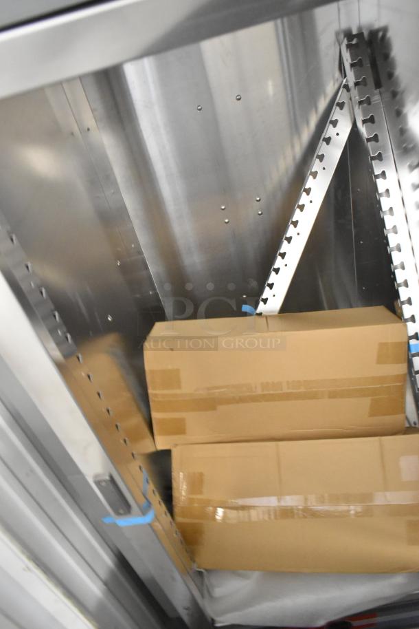 Brand new Metro C537-HFS-U-GY heated holding cabinet interior, featuring adjustable shelves, boxes included. 120V, 1 phase.