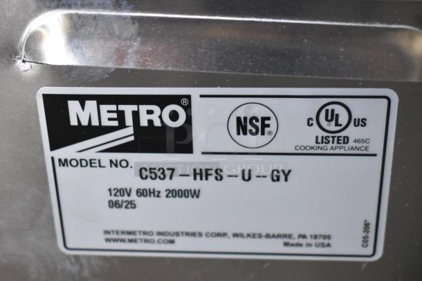 Metro C537-HFS-U-GY heated holding cabinet label showing NSF and UL certifications, 120V, 60Hz, 2000W specs.